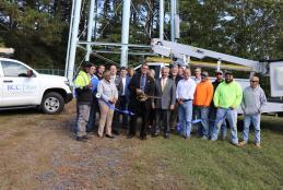  Worcester County Commissioners joined Bay Country Communications (BCC) officials at the foot of the Newark water tower on October 19, 2022 to cut the ribbon on a new fiber-optic installation project to make broadband available in the Newark area. 